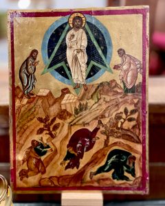 Stylised iconographic image of the Transfiguration from the Bible, with Jesus central, Moses and Elijah either side, and Peter, James and John on the ground in front